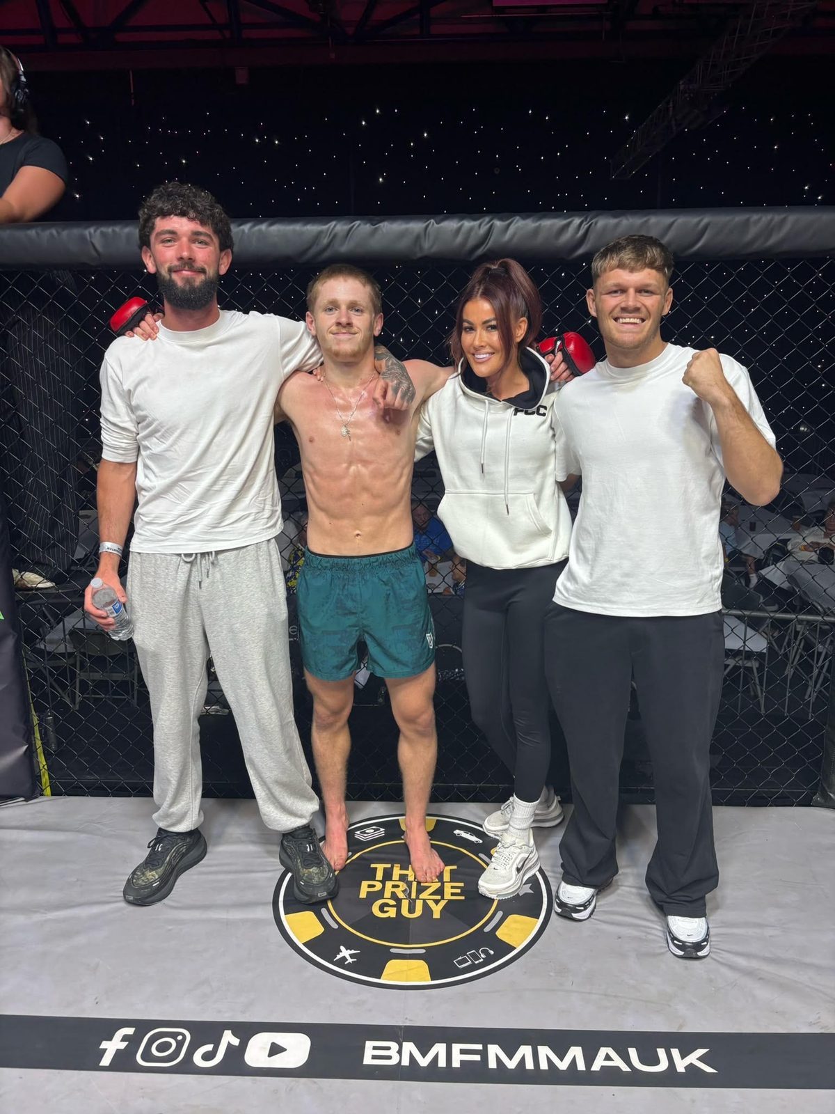 The Two More Mission team in the cage after a fight